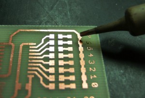 Soldering SMD by hand: applying tin to the pads.